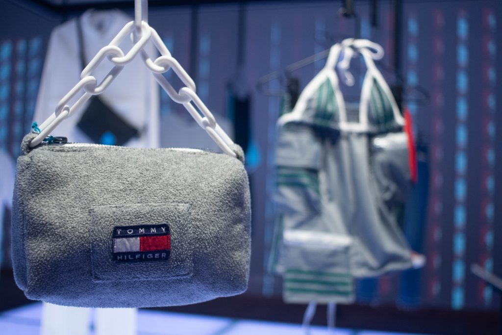 A sustainable Tommy Hilfiger bag hangs on display in the Fashion for Good Museum main room on the ground floor